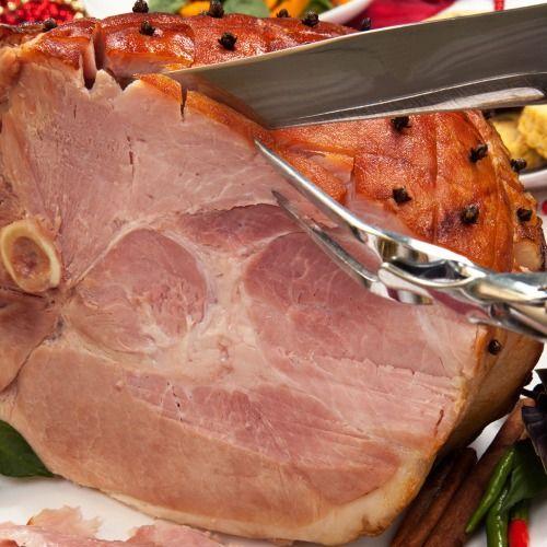 Chef carving a ham